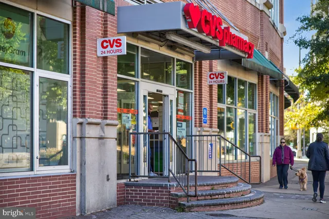 a front view of a building with a garden