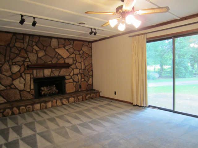 2120 Osburn Road Arrington, TN 37014 - Photo 8 of 20 Den on lower level with 4th bedroom/full bath * Propane tank for fireplace *