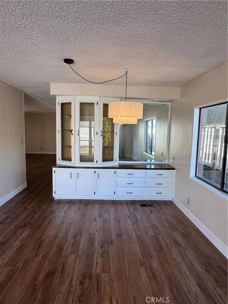 8651 Foothill, Unit 157 Rancho Cucamonga, CA 91730 - Photo 3 of 19 wooden floor in an empty room with a window