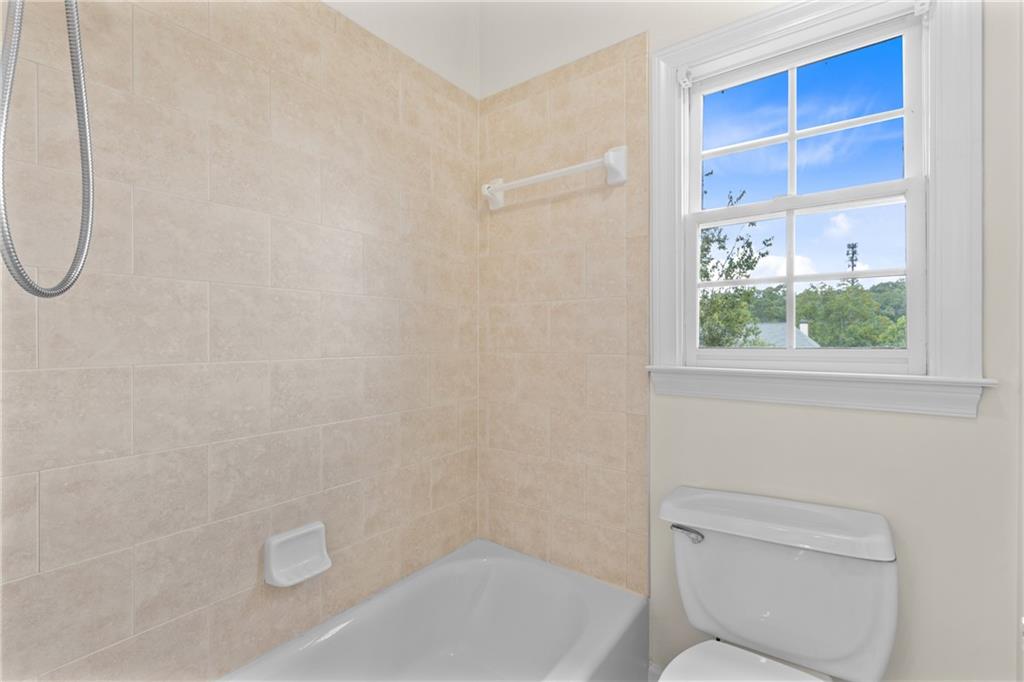 5765 Bailey Ridge Court Duluth, GA 30097 - Photo 39 of 53 a bathroom with a toilet and a shower