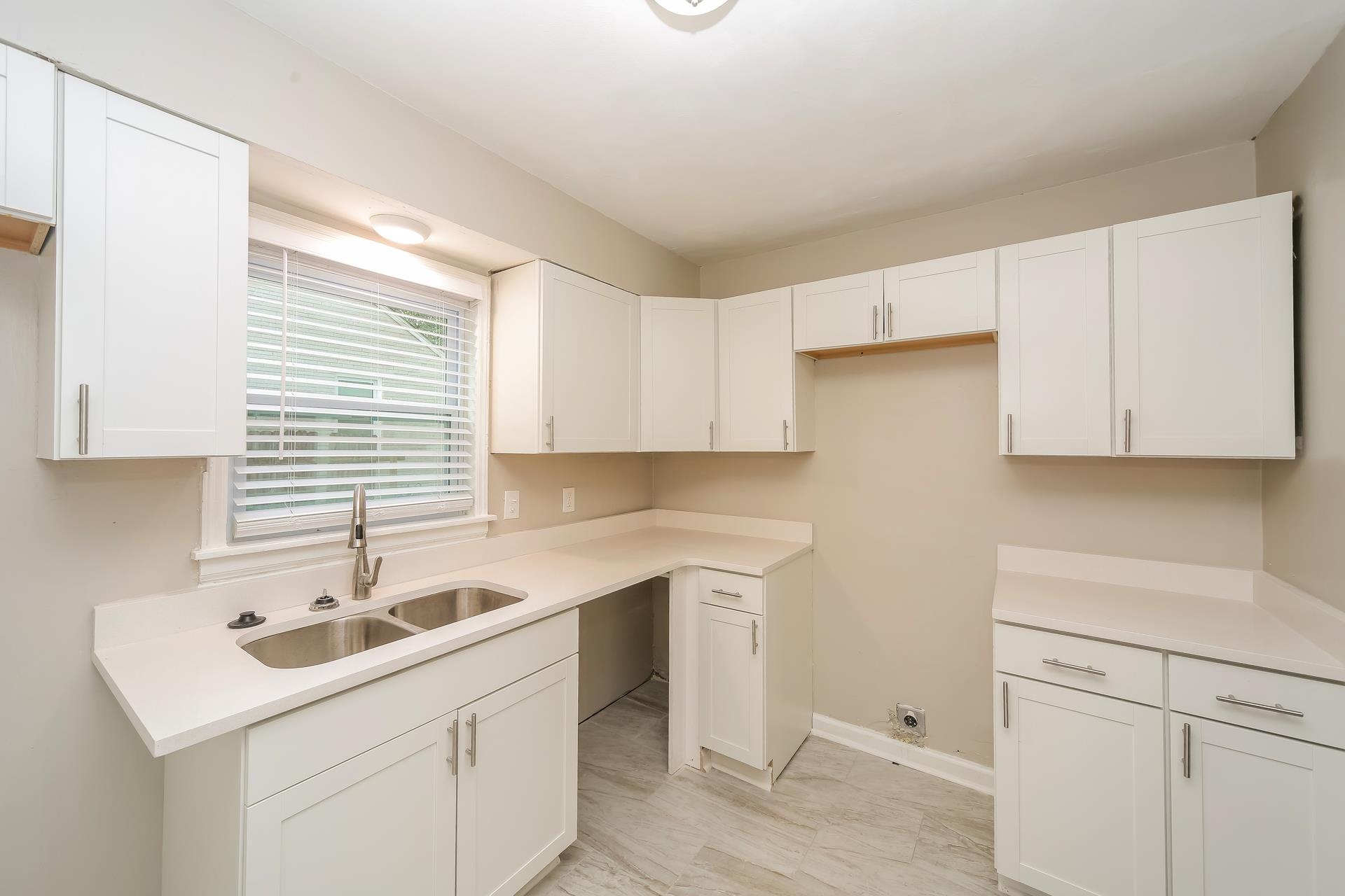 989 Wingfield Road Memphis, TN 38122 - Photo 8 of 15 a kitchen with a sink cabinets and window