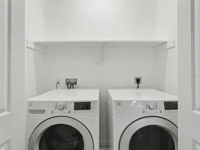 a utility room with dryer and washer
