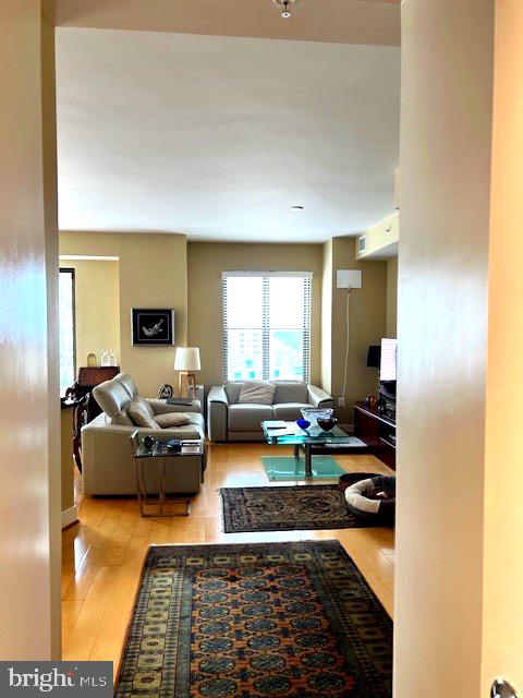 7710 Woodmont Avenue, Unit 911 Bethesda, MD 20814 - Photo 12 of 25 a living room with furniture and a rug