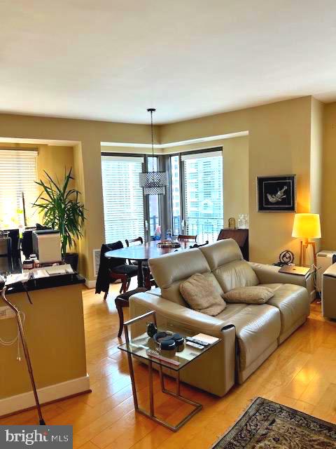 7710 Woodmont Avenue, Unit 911 Bethesda, MD 20814 - Photo 15 of 25 a living room with furniture and a large window