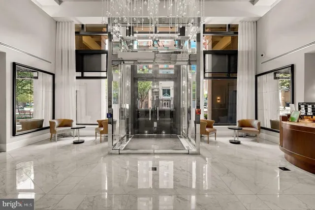 a lobby with furniture and floor