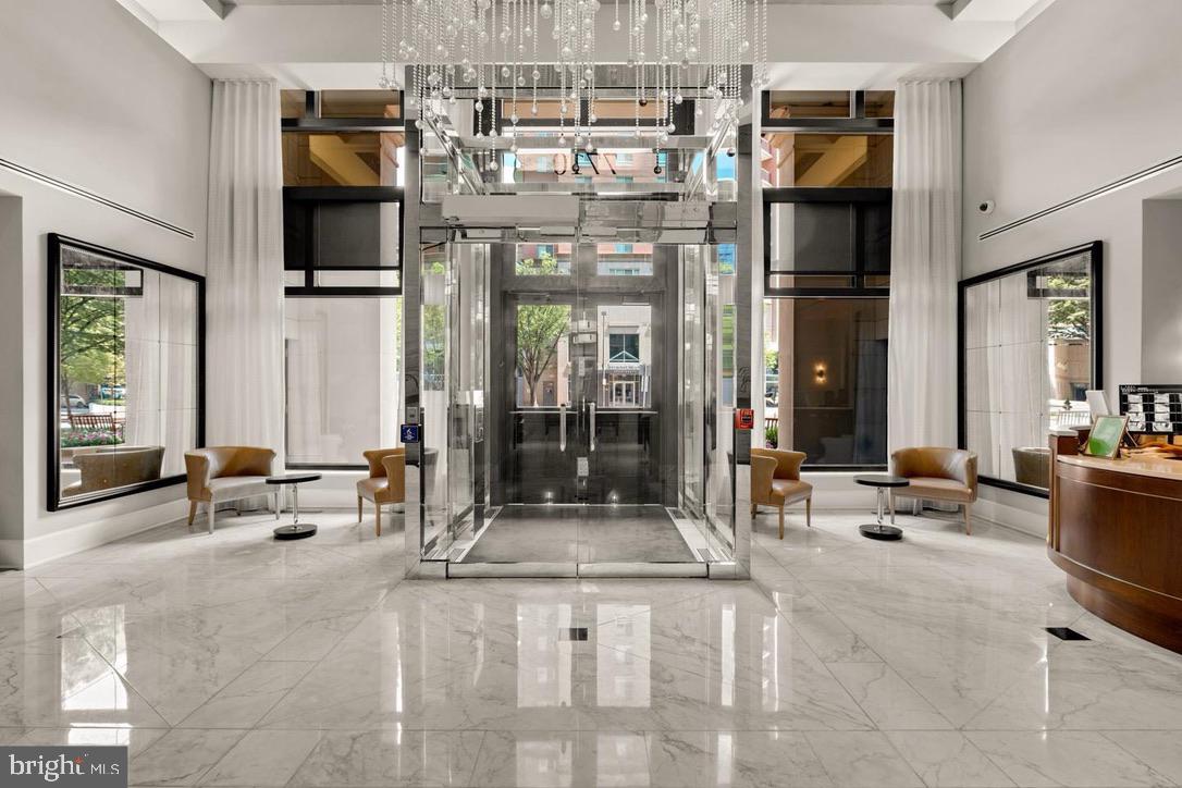 7710 Woodmont Avenue, Unit 911 Bethesda, MD 20814 - Photo 16 of 25 a lobby with furniture and floor