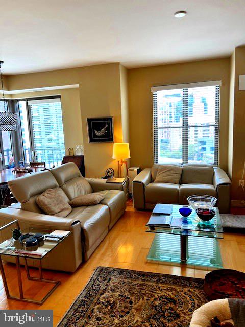 7710 Woodmont Avenue, Unit 911 Bethesda, MD 20814 - Photo 4 of 25 a living room with furniture rug and window