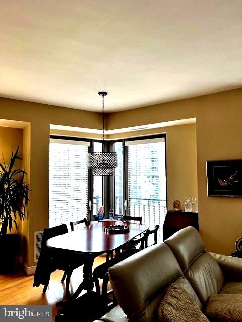 7710 Woodmont Avenue, Unit 911 Bethesda, MD 20814 - Photo 5 of 25 a living room with furniture and a large window