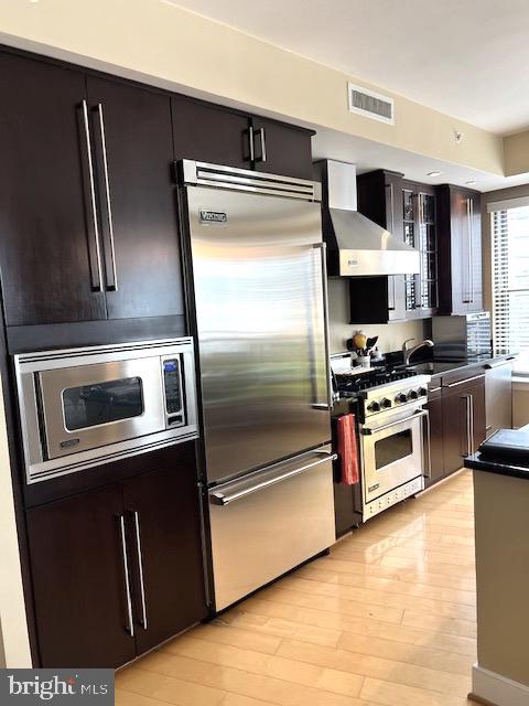 7710 Woodmont Avenue, Unit 911 Bethesda, MD 20814 - Photo 6 of 25 a kitchen with granite countertop a refrigerator and a stove top oven