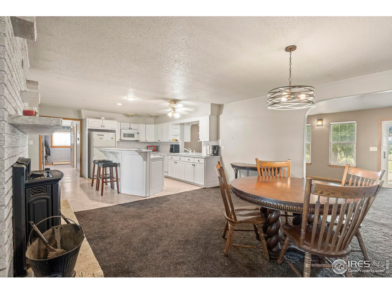 32864 County Road 49 Greeley, CO 80631 - Photo 11 of 40 a dining room with furniture and window