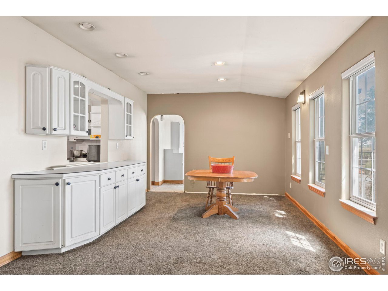 32864 County Road 49 Greeley, CO 80631 - Photo 14 of 40 a living room with furniture a rug and white walls