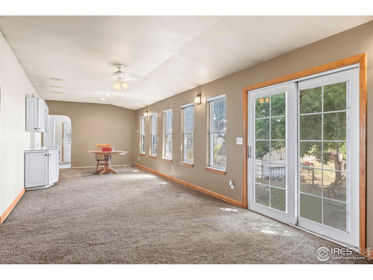 32864 County Road 49 Greeley, CO 80631 - Photo 16 of 40 a living room with furniture and large windows