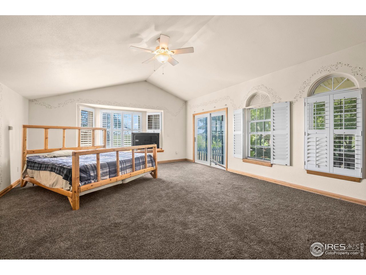 32864 County Road 49 Greeley, CO 80631 - Photo 18 of 40 a bedroom with a bed table and window