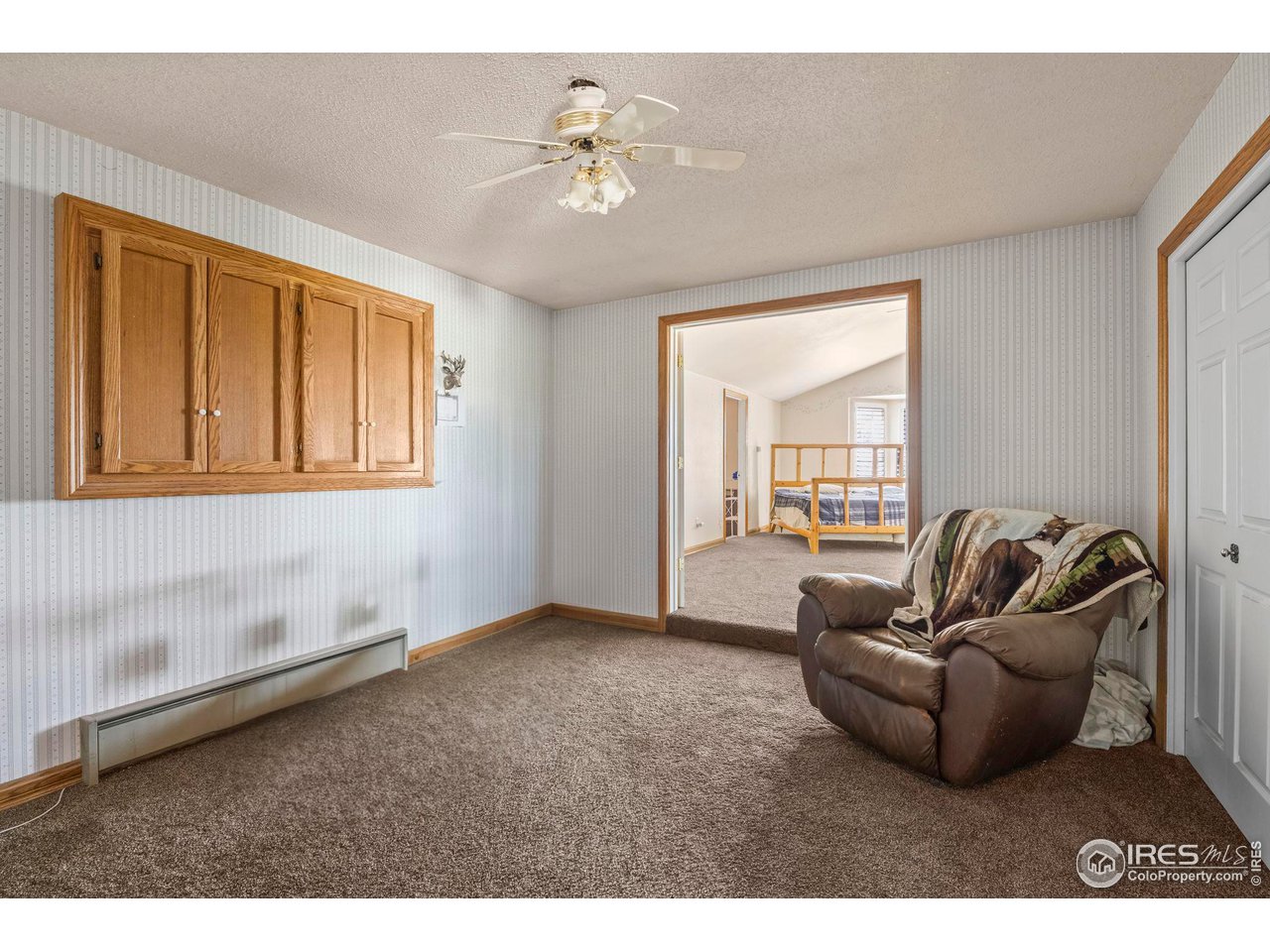 32864 County Road 49 Greeley, CO 80631 - Photo 20 of 40 a living room with furniture and a window