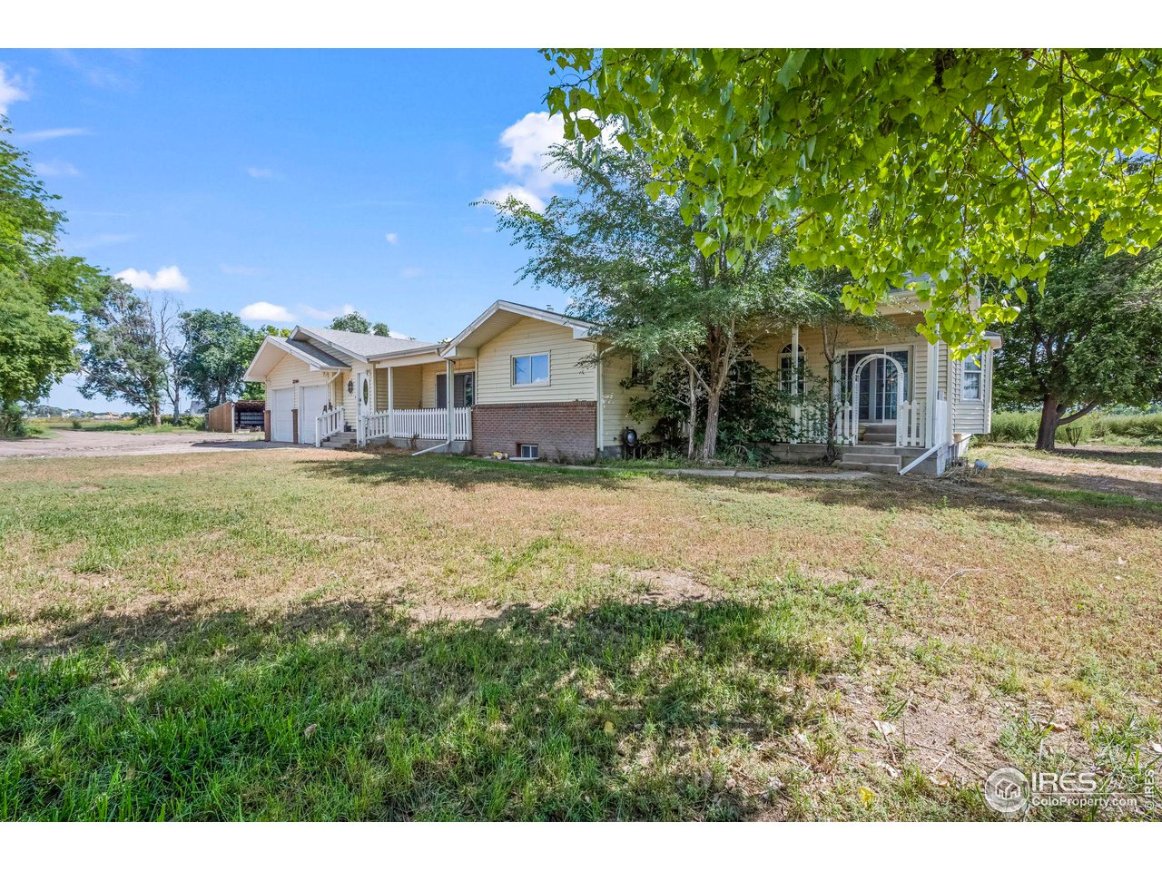 32864 County Road 49 Greeley, CO 80631 - Photo 2 of 40 a house view with a garden space