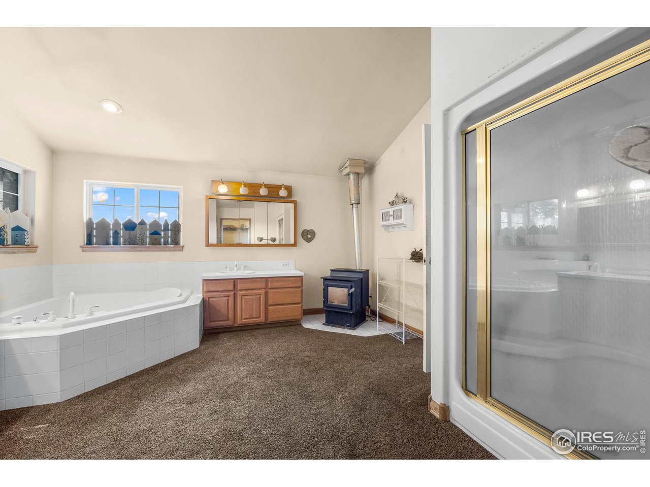 32864 County Road 49 Greeley, CO 80631 - Photo 24 of 40 a spacious bathroom with a bathtub and a shower