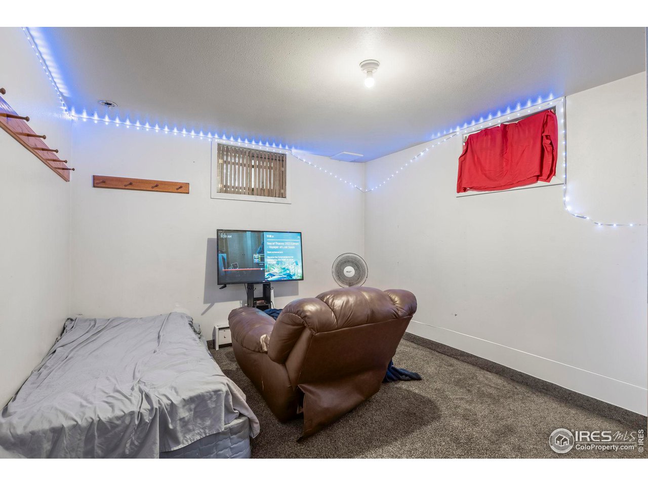 32864 County Road 49 Greeley, CO 80631 - Photo 26 of 40 a room with furniture and a chair