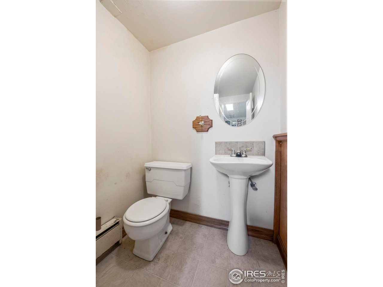 32864 County Road 49 Greeley, CO 80631 - Photo 28 of 40 a bathroom with a toilet sink and mirror