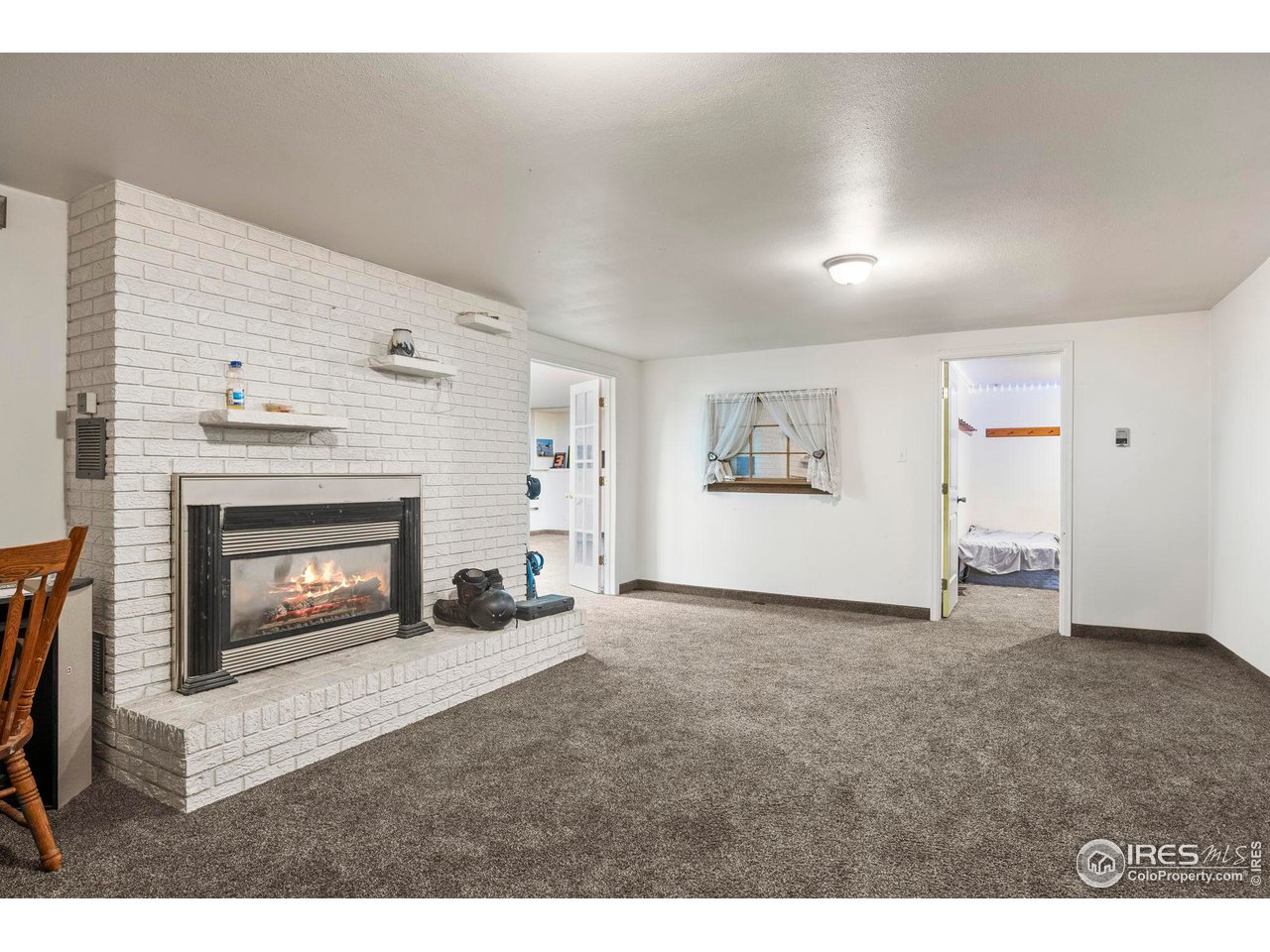 32864 County Road 49 Greeley, CO 80631 - Photo 30 of 40 a view of a livingroom with furniture and a fireplace