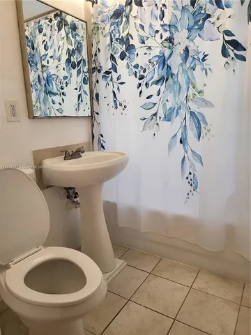 a bathroom with a toilet and a sink