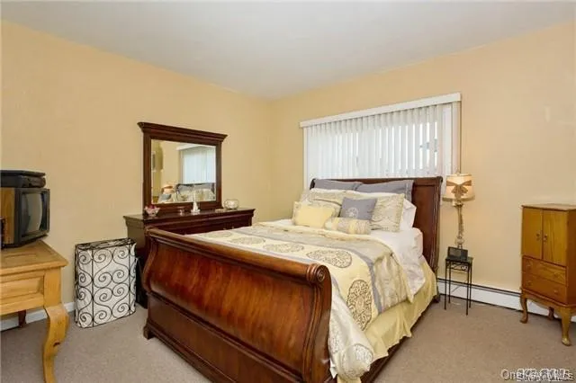 a view of kitchen with stainless steel appliances kitchen island sink stove and refrigerator