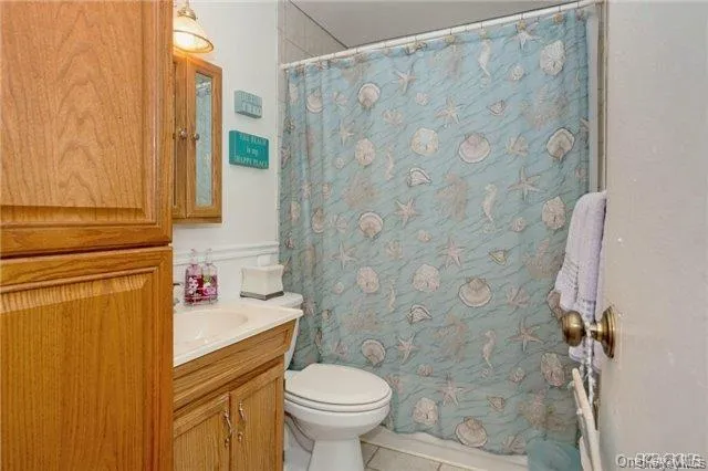 a bedroom with a bed and a dresser in it