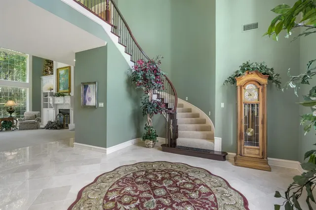 a kitchen with stainless steel appliances granite countertop a stove and a refrigerator