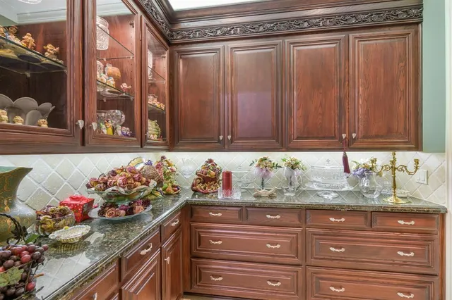 a view of living room with granite countertop furniture and a fireplace