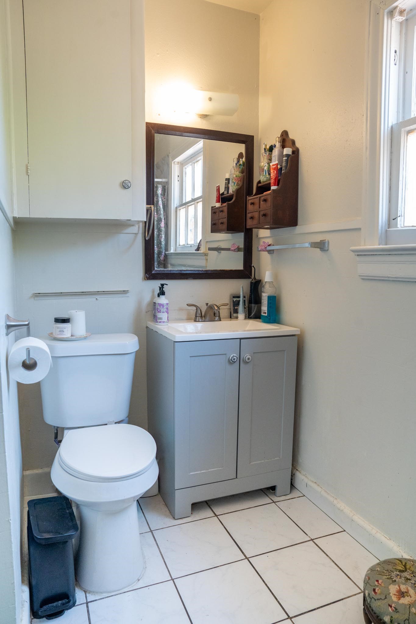 1909 Colquitt Street, Unit 7 Houston, TX 77098 - Photo 14 of 17 a bathroom with a toilet sink and mirror