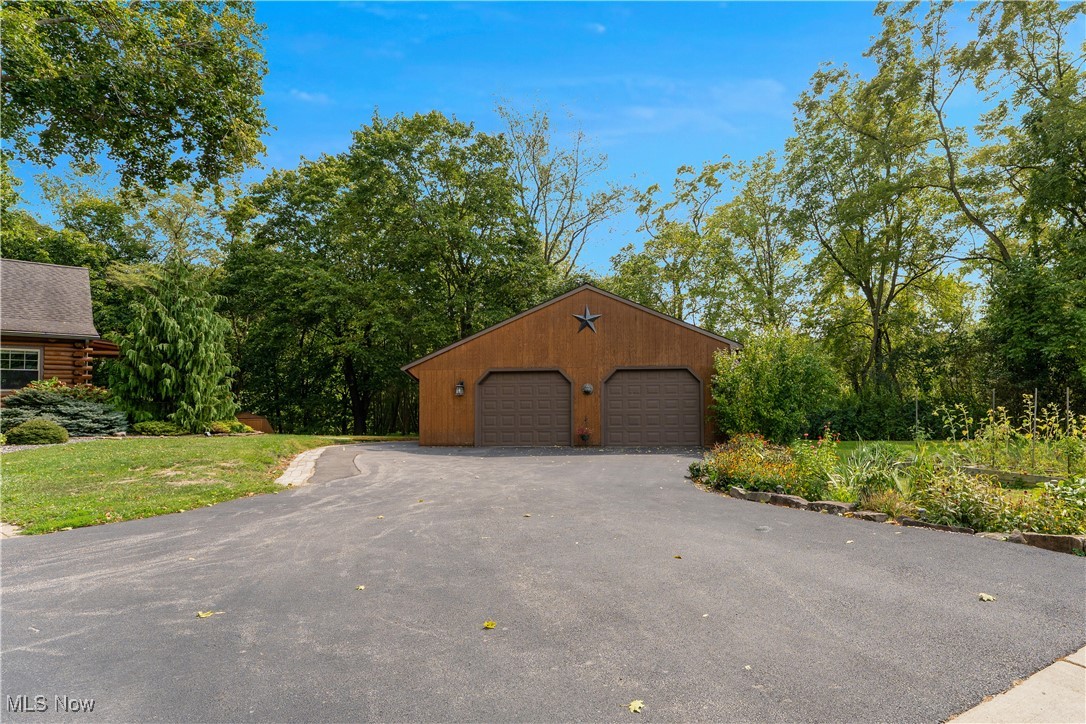 14 Clingan Road Struthers, OH 44471 - Photo 50 of 50 Detached garage featuring view of wooded area