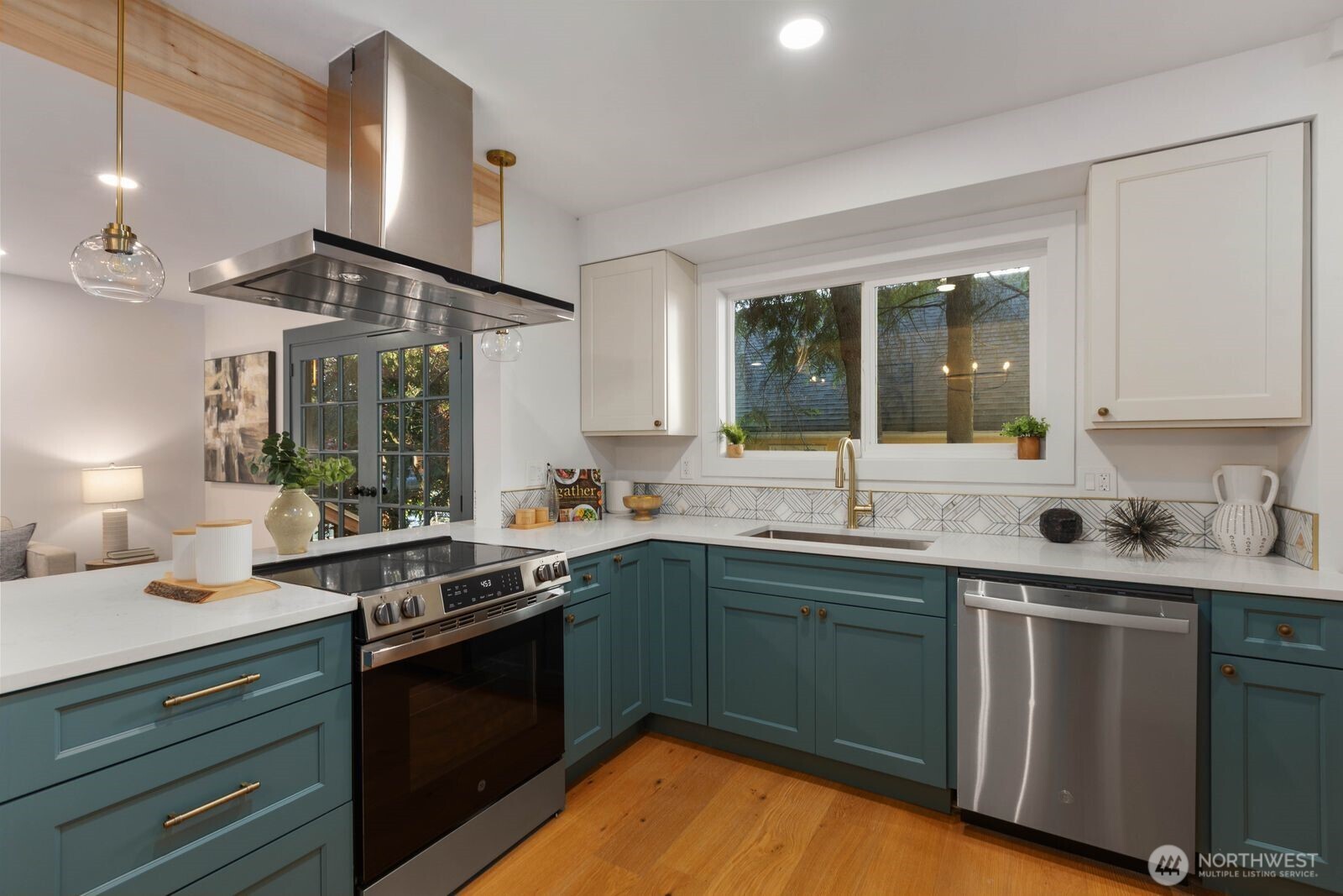 512 Northwest 44th Street Seattle, WA 98107 - Photo 10 of 37 a kitchen with a sink stove and cabinets