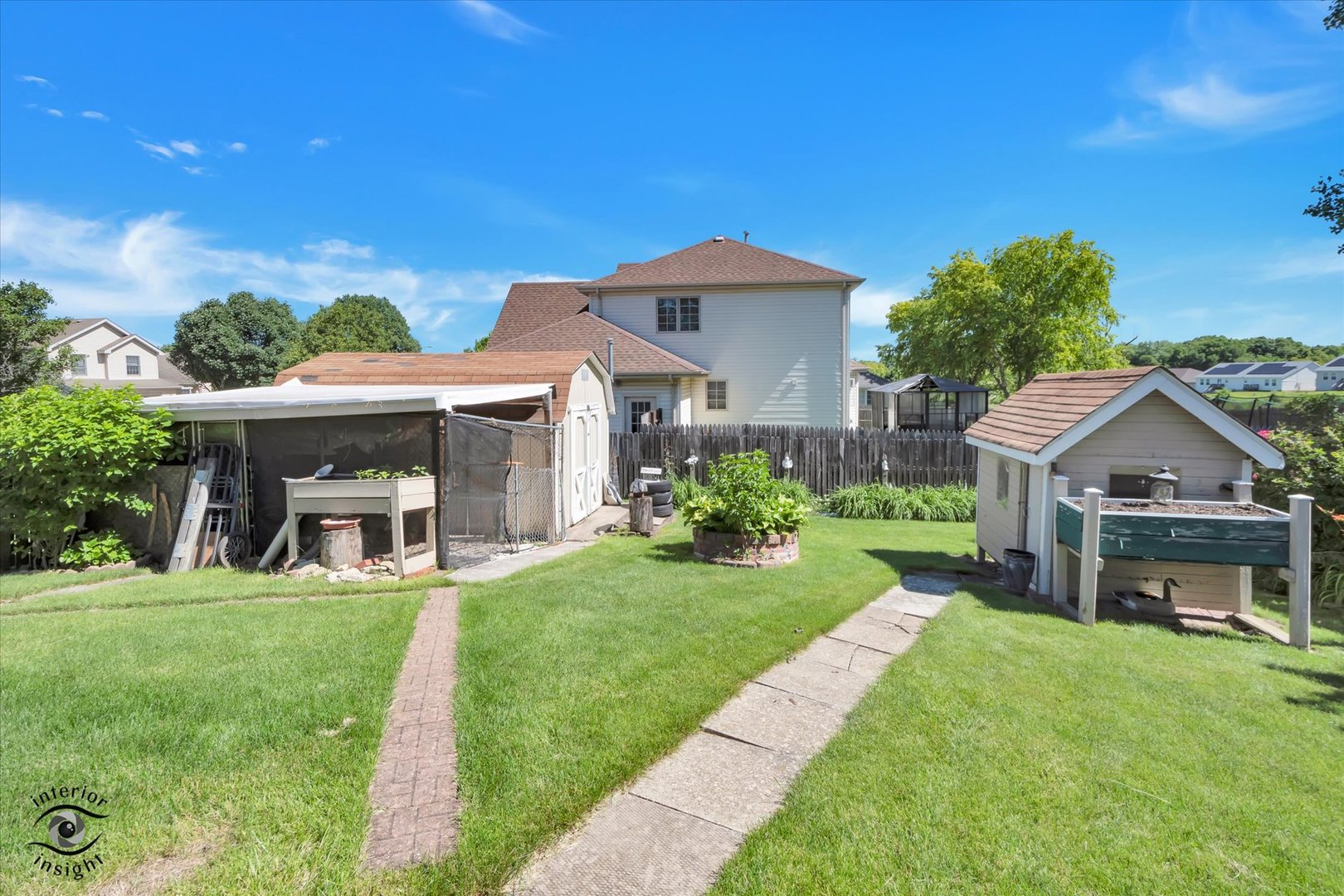 930 Meadowbrook Road Elwood, IL 60421 - Photo 24 of 25 a front view of a house with a yard table and chairs