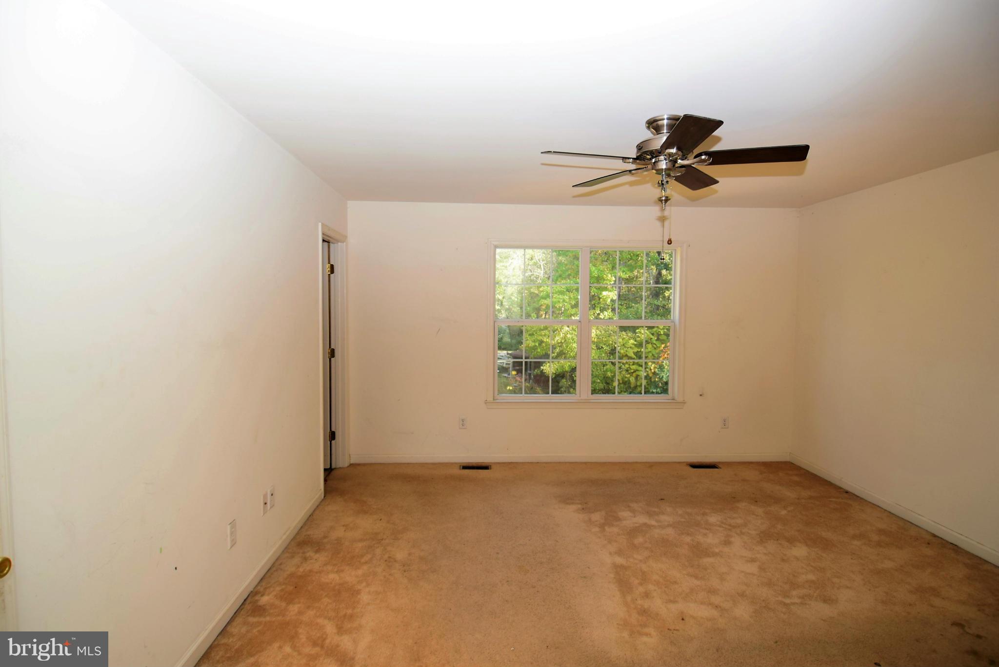 8063 Clark Station Road Severn, MD 21144 - Photo 14 of 27 an empty room with a window