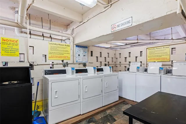 a kitchen with counter top space and windows