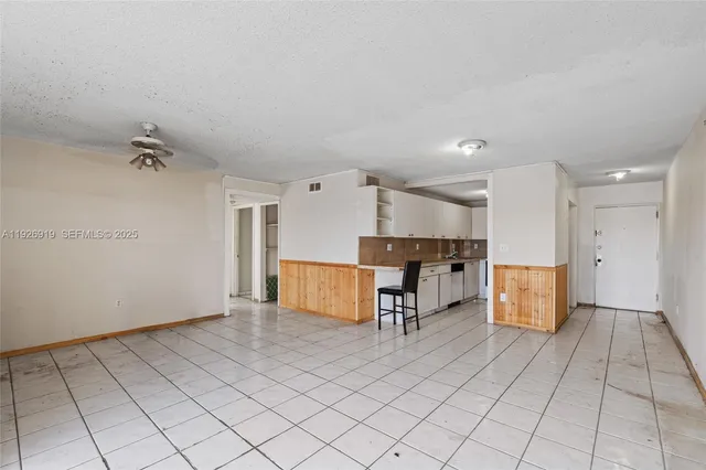 a view of kitchen with furniture and window