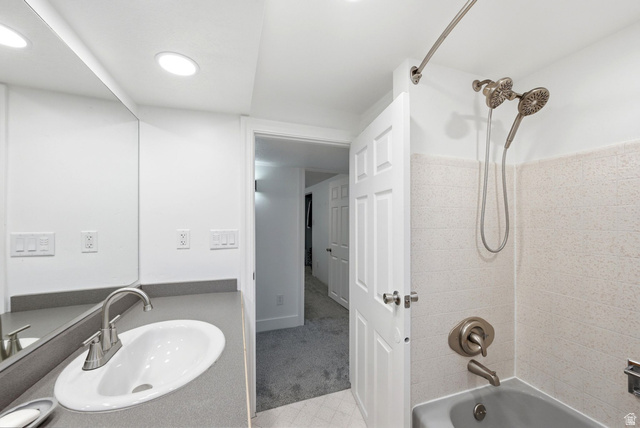 120 North 1230 E Street Springville, UT 84663 - Photo 30 of 60 Bathroom featuring a brushed nickel faucet, a spacious vanity, and a tub/shower combination with a multi-function showerhead