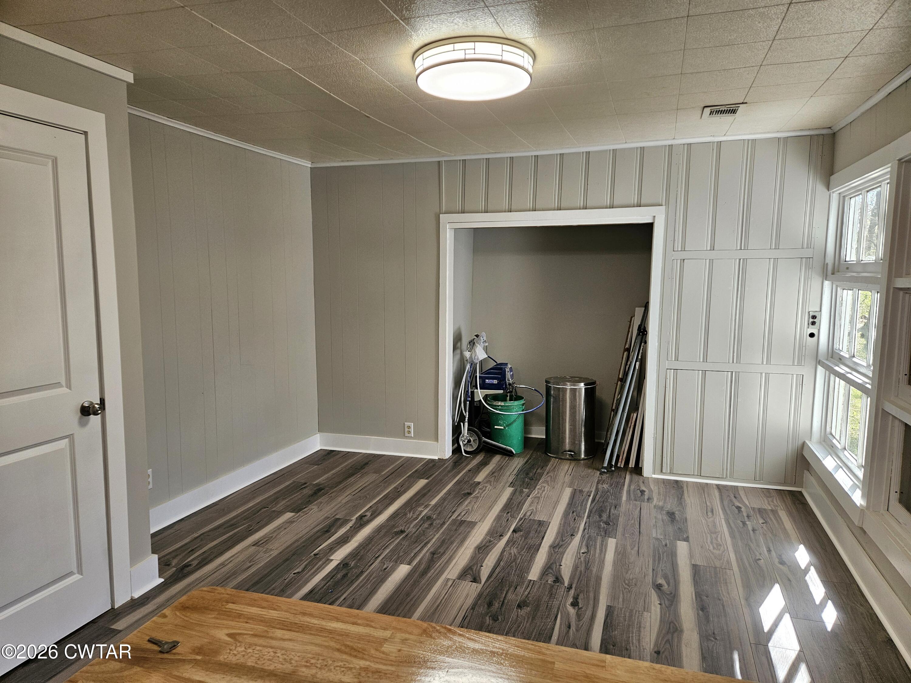 550 Lawrence Switch Road Jackson, TN 38305 - Photo 11 of 25 a bedroom with a bed and a chandelier