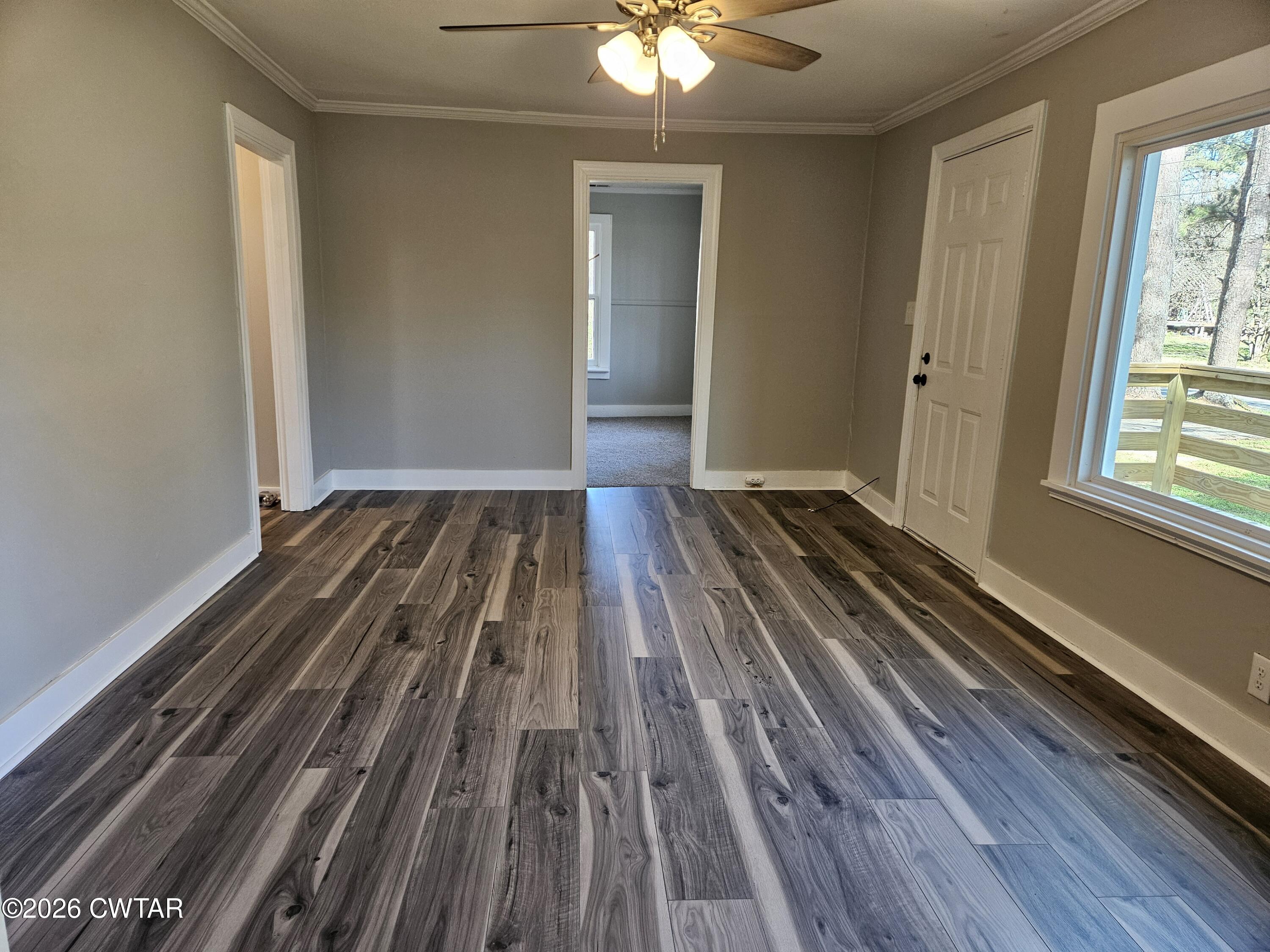550 Lawrence Switch Road Jackson, TN 38305 - Photo 12 of 25 wooden floor in an empty room with a window