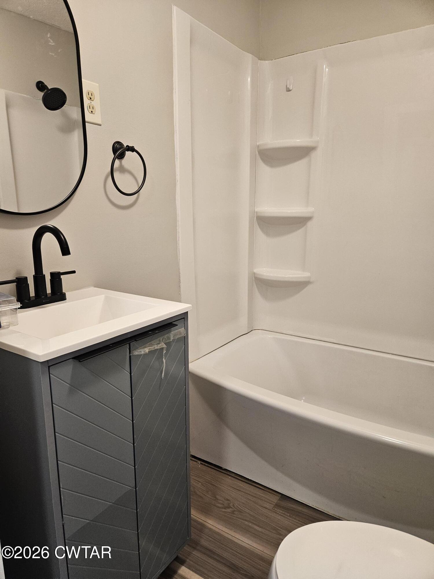 550 Lawrence Switch Road Jackson, TN 38305 - Photo 15 of 25 a bathroom with a sink and a mirror