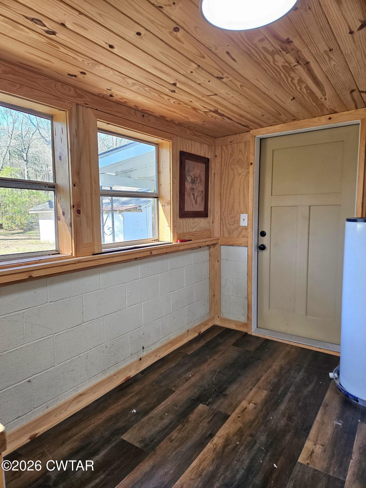 550 Lawrence Switch Road Jackson, TN 38305 - Photo 18 of 25 a view of an empty room with wooden floor and a window