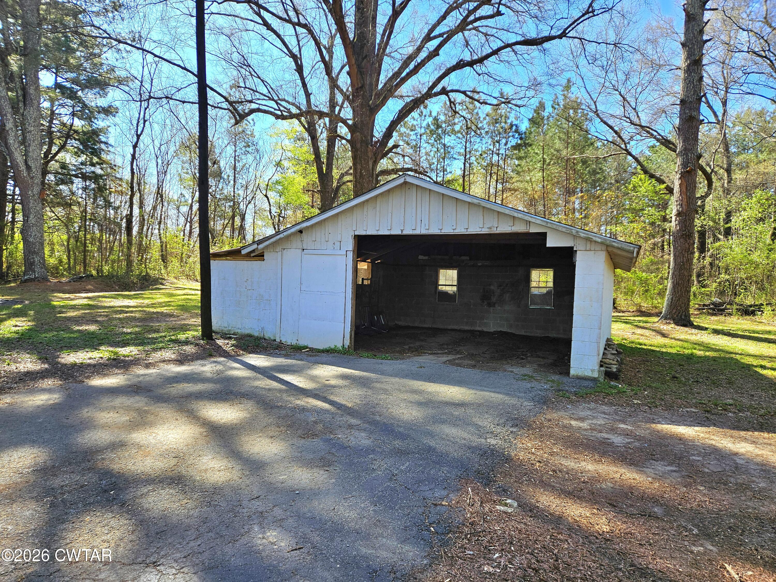 550 Lawrence Switch Road Jackson, TN 38305 - Photo 21 of 25 a front view of a house with a yard
