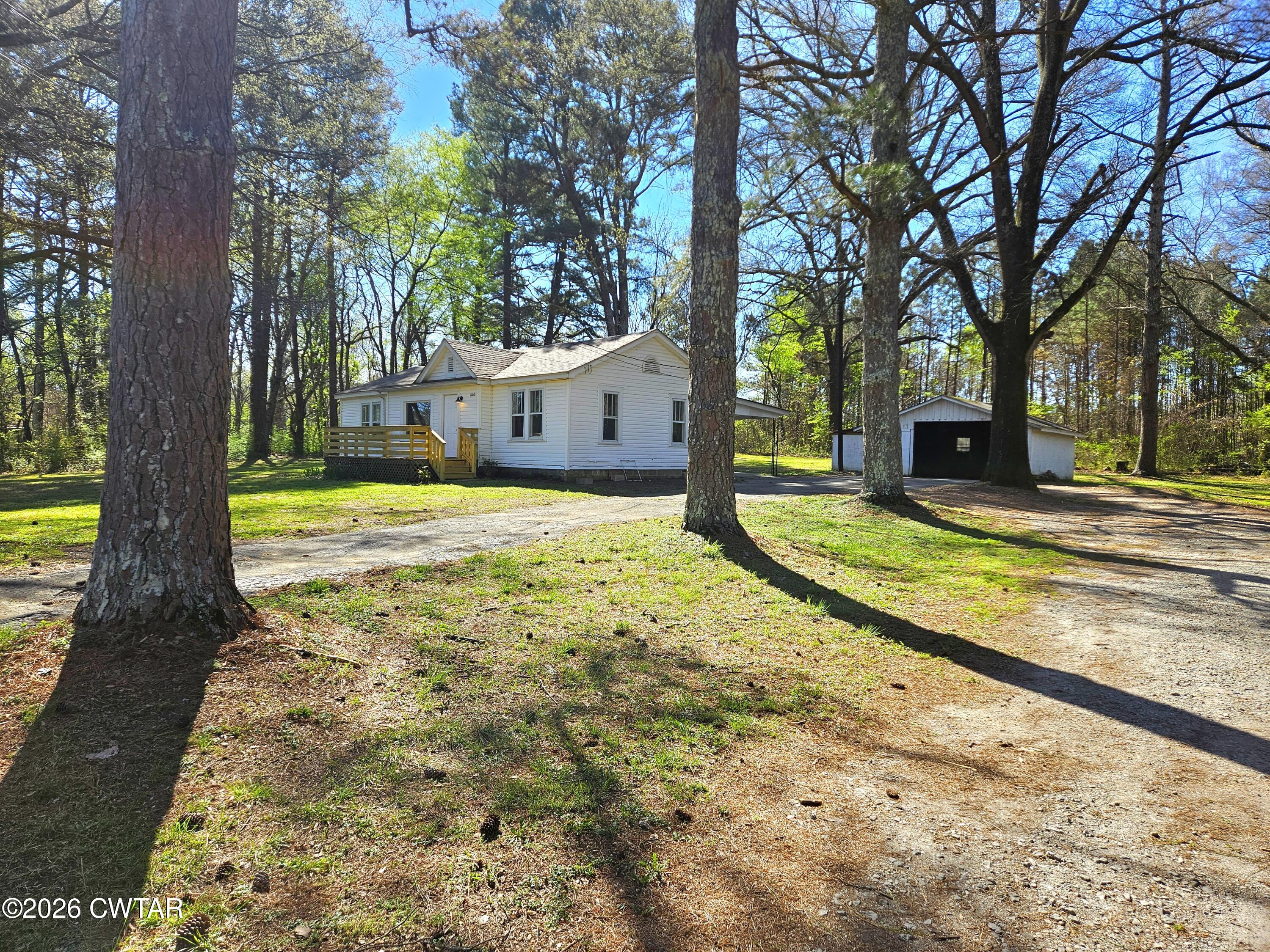 550 Lawrence Switch Road Jackson, TN 38305 - Photo 24 of 25 a view of a house with backyard and trees