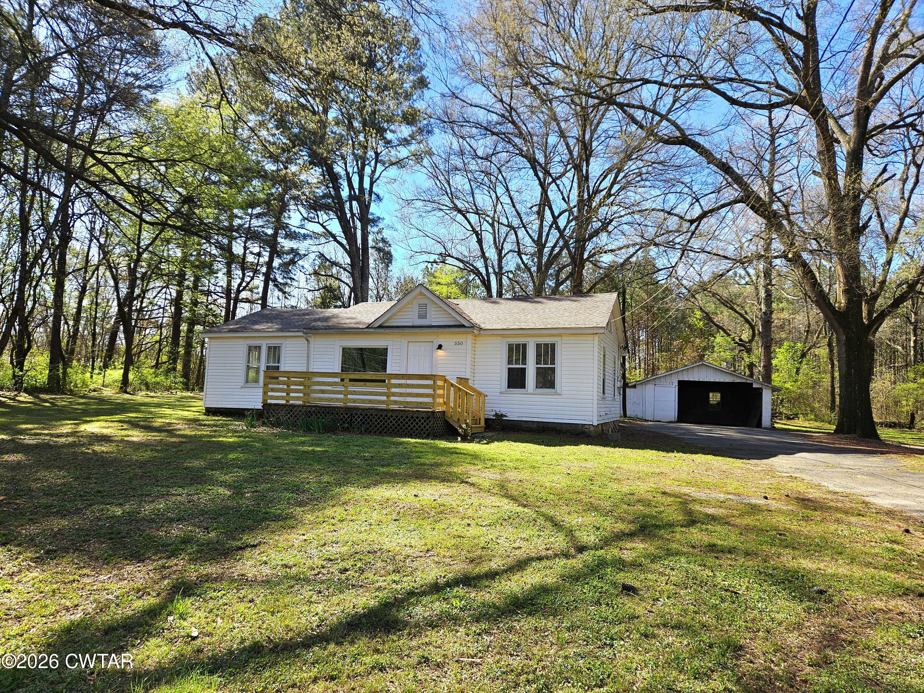 550 Lawrence Switch Road Jackson, TN 38305 - Photo 25 of 25 a view of a house with a yard