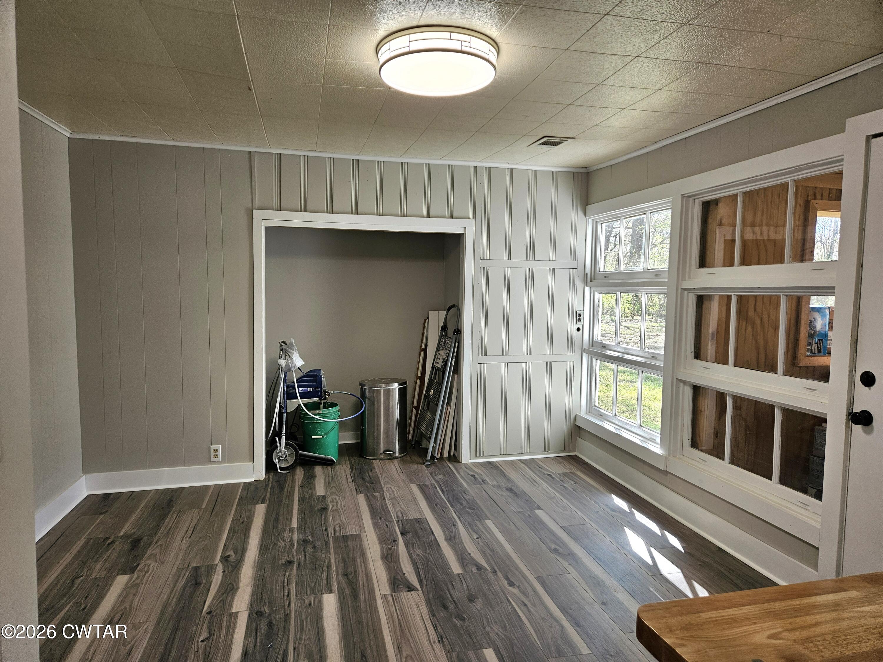 550 Lawrence Switch Road Jackson, TN 38305 - Photo 10 of 25 a view of a room with wooden floor and chair