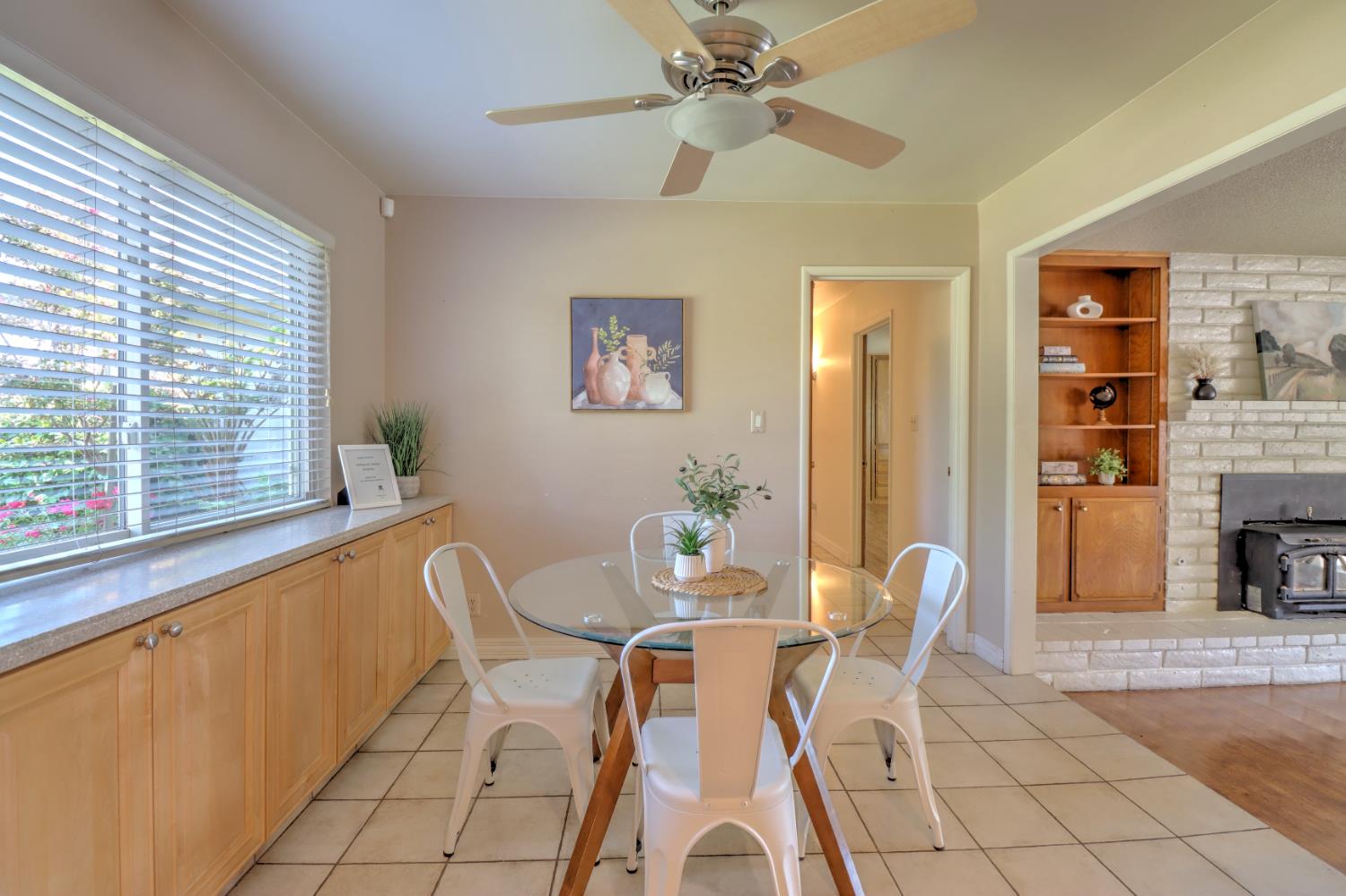 6265 North Colonial Avenue Fresno, CA 93704 - Photo 6 of 22 a dining room with furniture and a fireplace