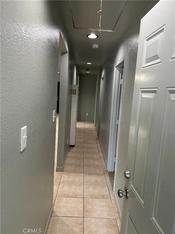 a view of an empty room and a window