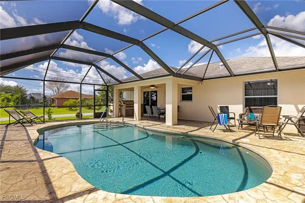 a view of a swimming pool with a patio
