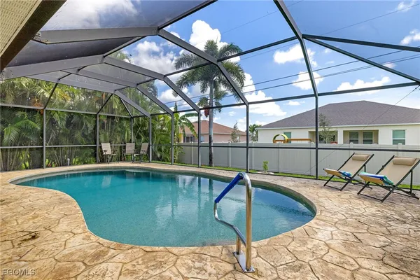 a view of a swimming pool with a patio
