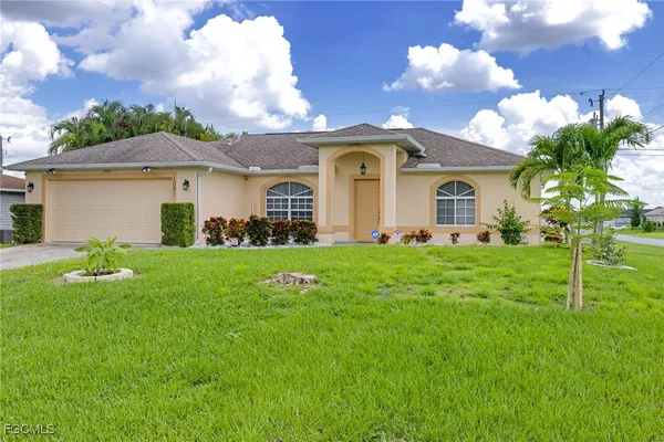 a front view of a house with garden
