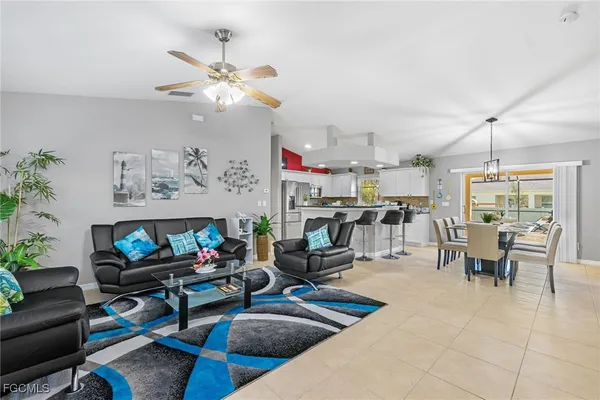 a living room with lots of furniture and white walls